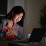 Candid Of Young Asian Woman Or Student Work Late Sitting On Desk